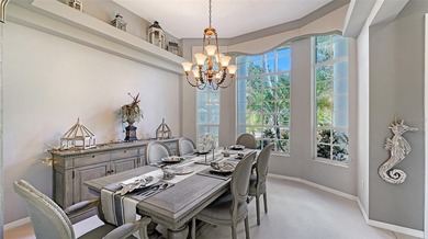 Welcome to this single-story home in the gated community of on University Park Country Club in Florida - for sale on GolfHomes.com, golf home, golf lot