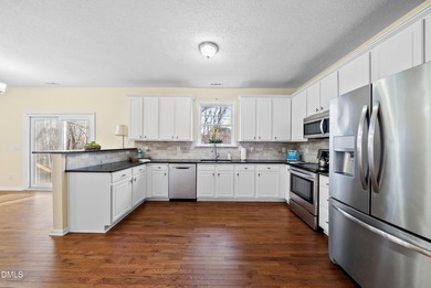 Beautifully maintained home is situated on a large lot next to a on The Crossings at Grove Park in North Carolina - for sale on GolfHomes.com, golf home, golf lot