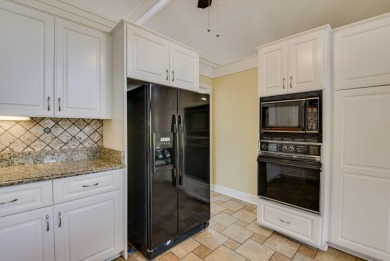 This contemporary stone and cedar West Lake home is nestled on a on West Lake Country Club in Georgia - for sale on GolfHomes.com, golf home, golf lot