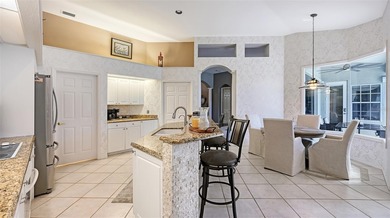 Welcome to this single-story home in the gated community of on University Park Country Club in Florida - for sale on GolfHomes.com, golf home, golf lot