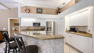 Welcome to this single-story home in the gated community of on University Park Country Club in Florida - for sale on GolfHomes.com, golf home, golf lot