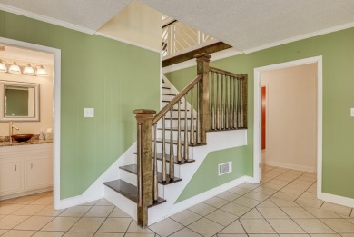 This contemporary stone and cedar West Lake home is nestled on a on West Lake Country Club in Georgia - for sale on GolfHomes.com, golf home, golf lot