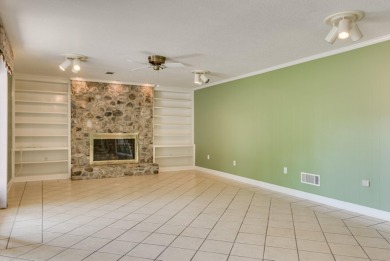 This contemporary stone and cedar West Lake home is nestled on a on West Lake Country Club in Georgia - for sale on GolfHomes.com, golf home, golf lot