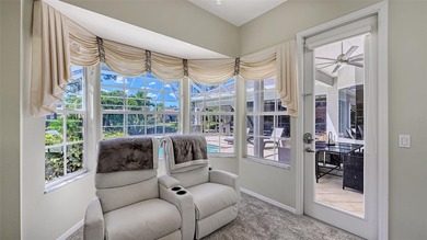 Welcome to this single-story home in the gated community of on University Park Country Club in Florida - for sale on GolfHomes.com, golf home, golf lot