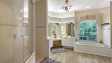 Welcome to this single-story home in the gated community of on University Park Country Club in Florida - for sale on GolfHomes.com, golf home, golf lot