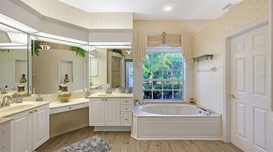 Welcome to this single-story home in the gated community of on University Park Country Club in Florida - for sale on GolfHomes.com, golf home, golf lot