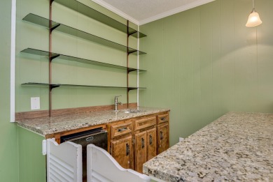 This contemporary stone and cedar West Lake home is nestled on a on West Lake Country Club in Georgia - for sale on GolfHomes.com, golf home, golf lot