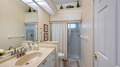 Welcome to this single-story home in the gated community of on University Park Country Club in Florida - for sale on GolfHomes.com, golf home, golf lot