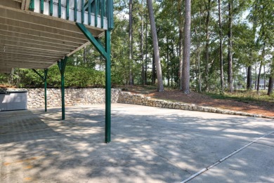 This contemporary stone and cedar West Lake home is nestled on a on West Lake Country Club in Georgia - for sale on GolfHomes.com, golf home, golf lot