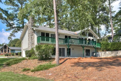 This contemporary stone and cedar West Lake home is nestled on a on West Lake Country Club in Georgia - for sale on GolfHomes.com, golf home, golf lot