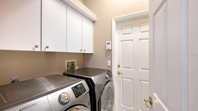 Welcome to this single-story home in the gated community of on University Park Country Club in Florida - for sale on GolfHomes.com, golf home, golf lot