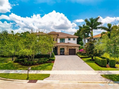 Nestled on the golf course & water in Parkland Golf & Country on Parkland Golf Club in Florida - for sale on GolfHomes.com, golf home, golf lot