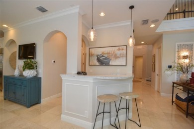 Nestled on the golf course & water in Parkland Golf & Country on Parkland Golf Club in Florida - for sale on GolfHomes.com, golf home, golf lot