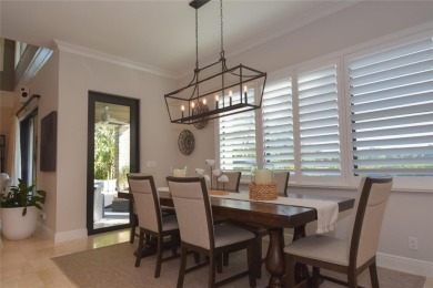 Nestled on the golf course & water in Parkland Golf & Country on Parkland Golf Club in Florida - for sale on GolfHomes.com, golf home, golf lot