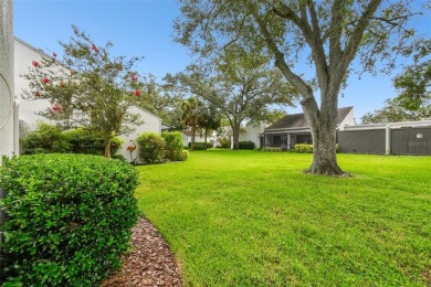 Welcome to your dream home in the prestigious Cypress Clusters on Carrollwood Country Club in Florida - for sale on GolfHomes.com, golf home, golf lot