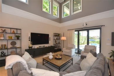 Nestled on the golf course & water in Parkland Golf & Country on Parkland Golf Club in Florida - for sale on GolfHomes.com, golf home, golf lot