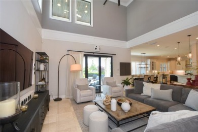 Nestled on the golf course & water in Parkland Golf & Country on Parkland Golf Club in Florida - for sale on GolfHomes.com, golf home, golf lot