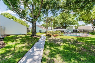 Welcome to your dream home in the prestigious Cypress Clusters on Carrollwood Country Club in Florida - for sale on GolfHomes.com, golf home, golf lot