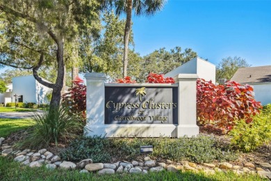 Welcome to your dream home in the prestigious Cypress Clusters on Carrollwood Country Club in Florida - for sale on GolfHomes.com, golf home, golf lot