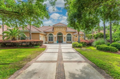 Luxurious family living all on one level in the esteemed gated on Regatta Bay Golf and Country Club in Florida - for sale on GolfHomes.com, golf home, golf lot