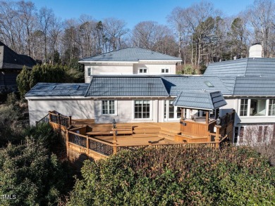 Welcome to 101 Rutherglen a Spanish-inspired villa that is a on MacGregor Downs Country Club in North Carolina - for sale on GolfHomes.com, golf home, golf lot