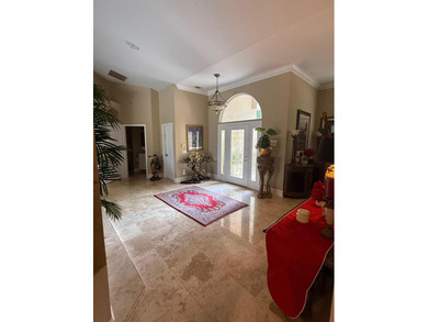 CUSTOM-BUILT POOL HOME OVERLOOKING THE 11TH HOLE IN SOUGHT-AFTER on St. Lucie Trail Golf Club in Florida - for sale on GolfHomes.com, golf home, golf lot