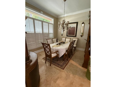 CUSTOM-BUILT POOL HOME OVERLOOKING THE 11TH HOLE IN SOUGHT-AFTER on St. Lucie Trail Golf Club in Florida - for sale on GolfHomes.com, golf home, golf lot