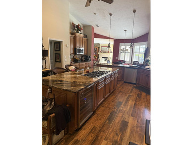 CUSTOM-BUILT POOL HOME OVERLOOKING THE 11TH HOLE IN SOUGHT-AFTER on St. Lucie Trail Golf Club in Florida - for sale on GolfHomes.com, golf home, golf lot