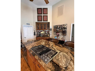 CUSTOM-BUILT POOL HOME OVERLOOKING THE 11TH HOLE IN SOUGHT-AFTER on St. Lucie Trail Golf Club in Florida - for sale on GolfHomes.com, golf home, golf lot