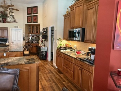 CUSTOM-BUILT POOL HOME OVERLOOKING THE 11TH HOLE IN SOUGHT-AFTER on St. Lucie Trail Golf Club in Florida - for sale on GolfHomes.com, golf home, golf lot