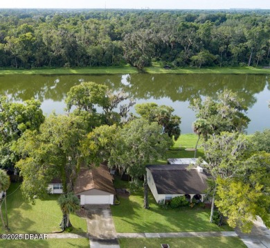 Charming 3-Bedroom Home with Pond Views & Golf Course Access
 on Riviera Country Club in Florida - for sale on GolfHomes.com, golf home, golf lot