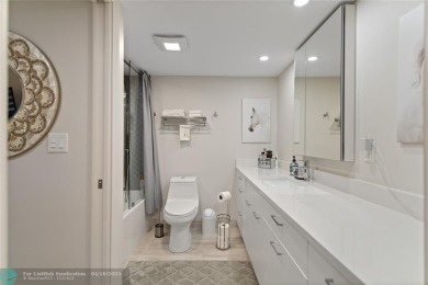 Beautifully renovated, spacious residence with large, screened on Palm-Aire Country Club and Resort - Palms in Florida - for sale on GolfHomes.com, golf home, golf lot
