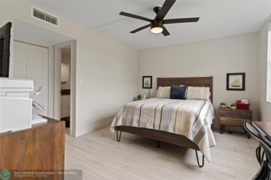 Beautifully renovated, spacious residence with large, screened on Palm-Aire Country Club and Resort - Palms in Florida - for sale on GolfHomes.com, golf home, golf lot
