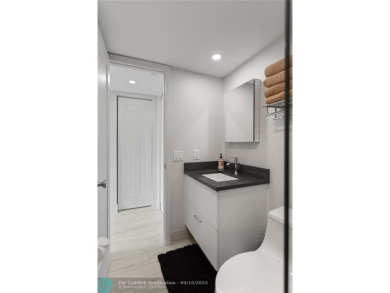 Beautifully renovated, spacious residence with large, screened on Palm-Aire Country Club and Resort - Palms in Florida - for sale on GolfHomes.com, golf home, golf lot