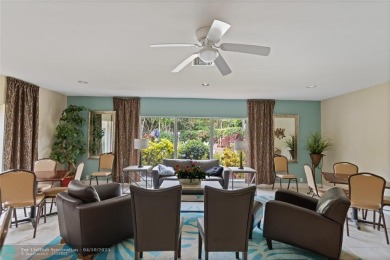Beautifully renovated, spacious residence with large, screened on Palm-Aire Country Club and Resort - Palms in Florida - for sale on GolfHomes.com, golf home, golf lot