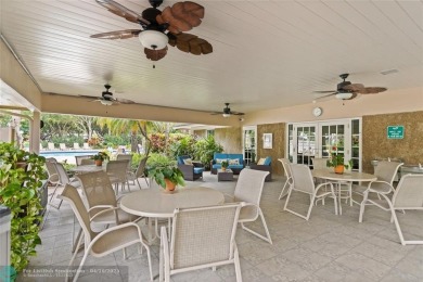 Beautifully renovated, spacious residence with large, screened on Palm-Aire Country Club and Resort - Palms in Florida - for sale on GolfHomes.com, golf home, golf lot