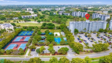 Beautifully renovated, spacious residence with large, screened on Palm-Aire Country Club and Resort - Palms in Florida - for sale on GolfHomes.com, golf home, golf lot