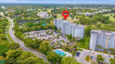 Beautifully renovated, spacious residence with large, screened on Palm-Aire Country Club and Resort - Palms in Florida - for sale on GolfHomes.com, golf home, golf lot