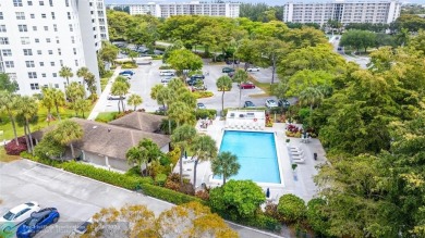 Beautifully renovated, spacious residence with large, screened on Palm-Aire Country Club and Resort - Palms in Florida - for sale on GolfHomes.com, golf home, golf lot