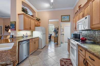 Coventry Model with a 2024 ROOF, resurfaced POOL in 2023 & NEWER on Plantation Bay Golf and Country Club in Florida - for sale on GolfHomes.com, golf home, golf lot