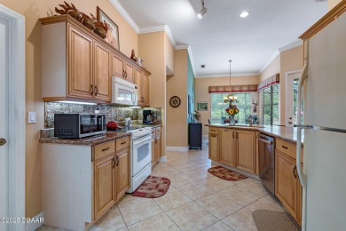 Coventry Model with a 2024 ROOF, resurfaced POOL in 2023 & NEWER on Plantation Bay Golf and Country Club in Florida - for sale on GolfHomes.com, golf home, golf lot