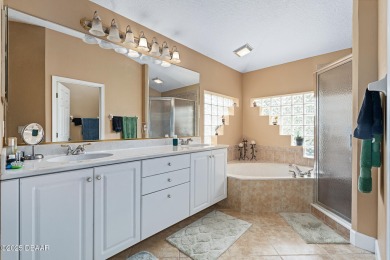 Coventry Model with a 2024 ROOF, resurfaced POOL in 2023 & NEWER on Plantation Bay Golf and Country Club in Florida - for sale on GolfHomes.com, golf home, golf lot