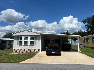 This well maintained and beautifully furnished home, in active on Lake Henry Golf Club in Florida - for sale on GolfHomes.com, golf home, golf lot