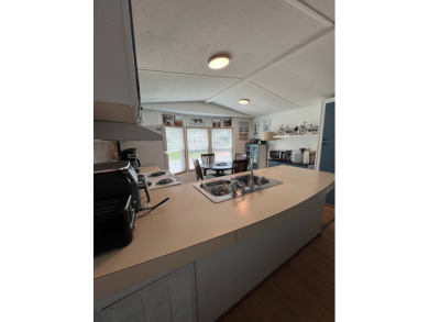 This well maintained and beautifully furnished home, in active on Lake Henry Golf Club in Florida - for sale on GolfHomes.com, golf home, golf lot