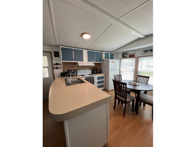 This well maintained and beautifully furnished home, in active on Lake Henry Golf Club in Florida - for sale on GolfHomes.com, golf home, golf lot