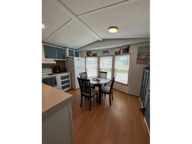 This well maintained and beautifully furnished home, in active on Lake Henry Golf Club in Florida - for sale on GolfHomes.com, golf home, golf lot