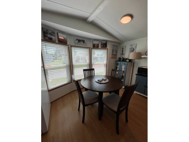 This well maintained and beautifully furnished home, in active on Lake Henry Golf Club in Florida - for sale on GolfHomes.com, golf home, golf lot