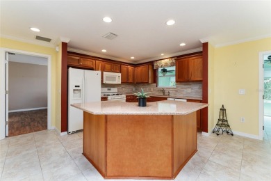 Welcome to this well-maintained AMARILLO MODEL located in the on The Links of Spruce Creek in Florida - for sale on GolfHomes.com, golf home, golf lot