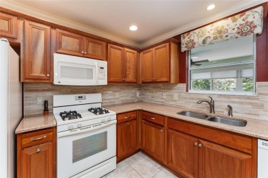 Welcome to this well-maintained AMARILLO MODEL located in the on The Links of Spruce Creek in Florida - for sale on GolfHomes.com, golf home, golf lot