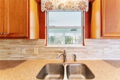 Welcome to this well-maintained AMARILLO MODEL located in the on The Links of Spruce Creek in Florida - for sale on GolfHomes.com, golf home, golf lot
